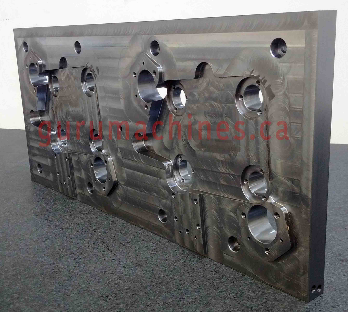 Large machined aluminum manifold plate with pocketed features